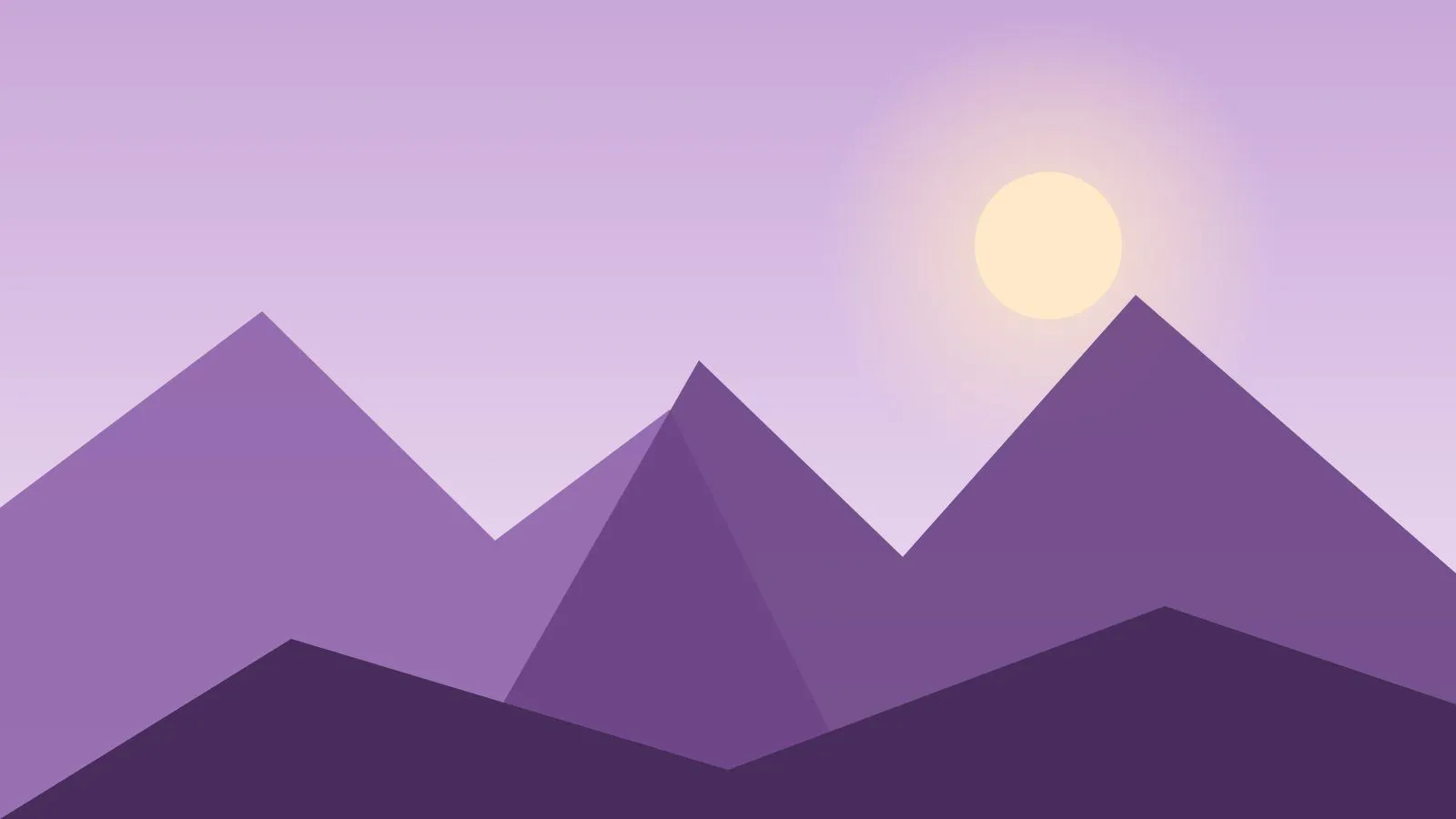 Cielo violeta del anochecer sobre siluetas de montañas